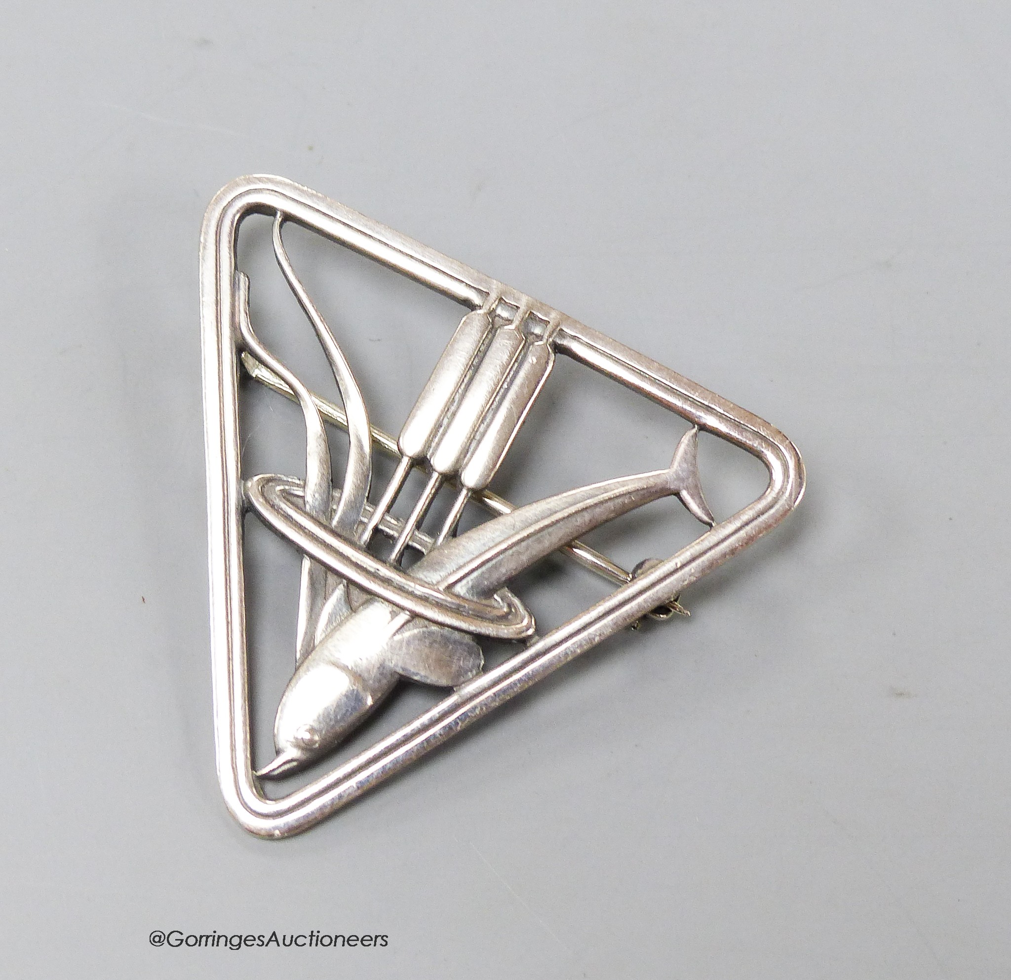 A Georg Jensen sterling dolphin and bulrush triangular brooch, no. 257, designed by Arno Malinowski, 37mm.